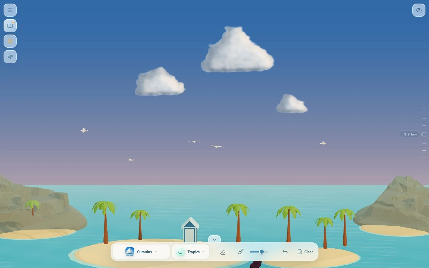 Clouds catch the warm sunset over a tropical island
